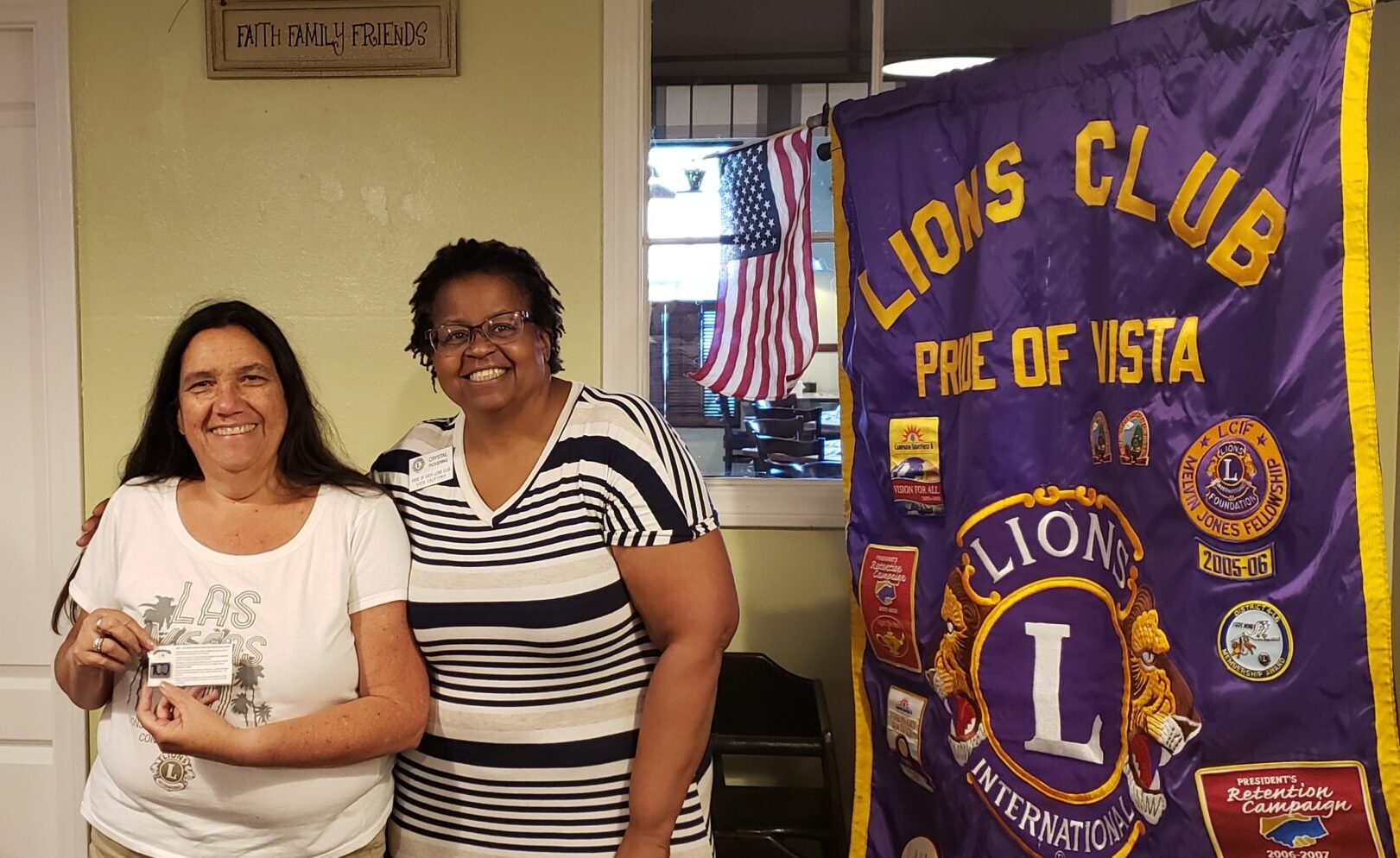Lion President Crystal (R) giving an award to Lion Anita for most new members sponsored in our 100th year.